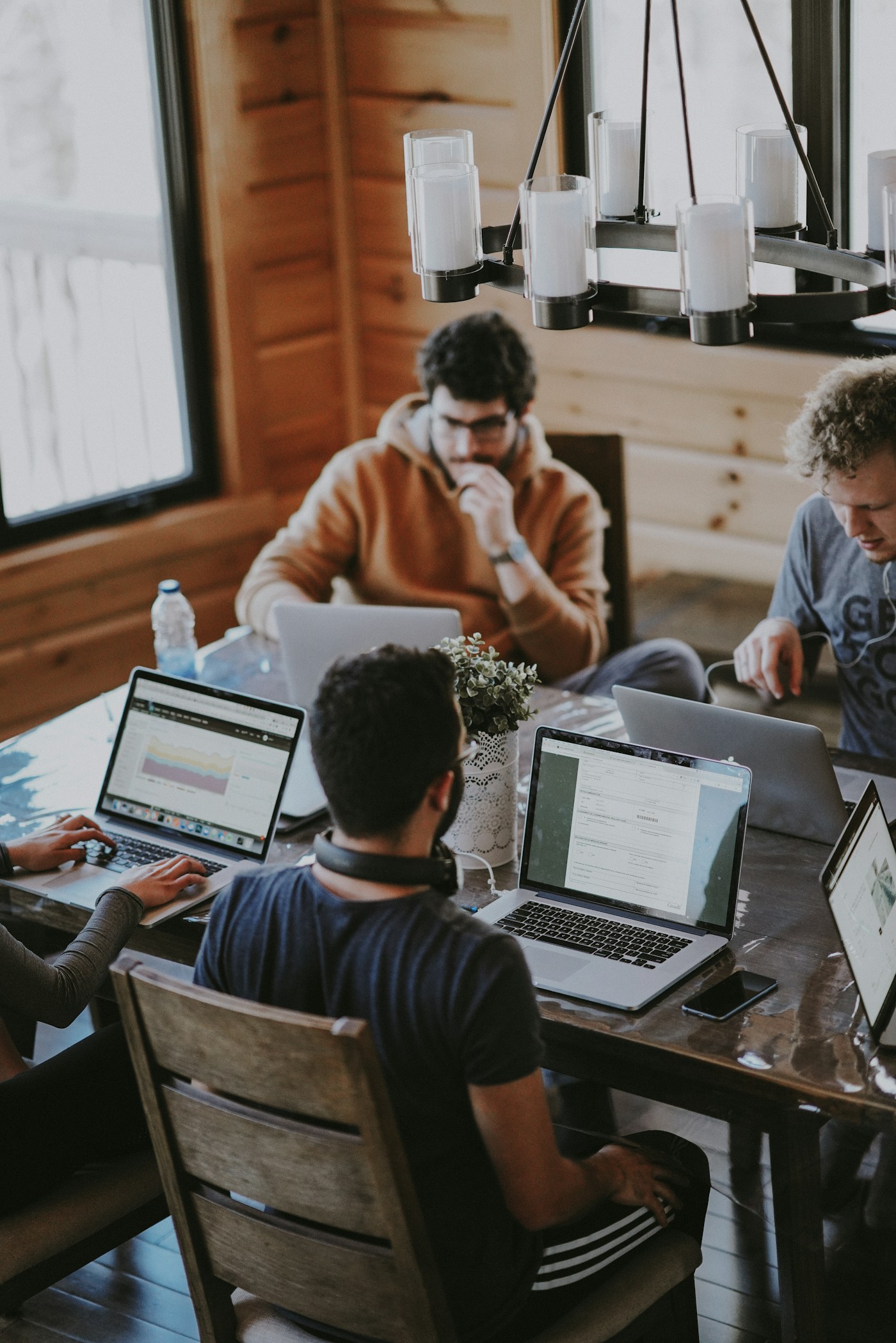 Colleagues working together around an office table